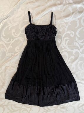 Sleeveless Black Midi Dress with Rosette Bodice